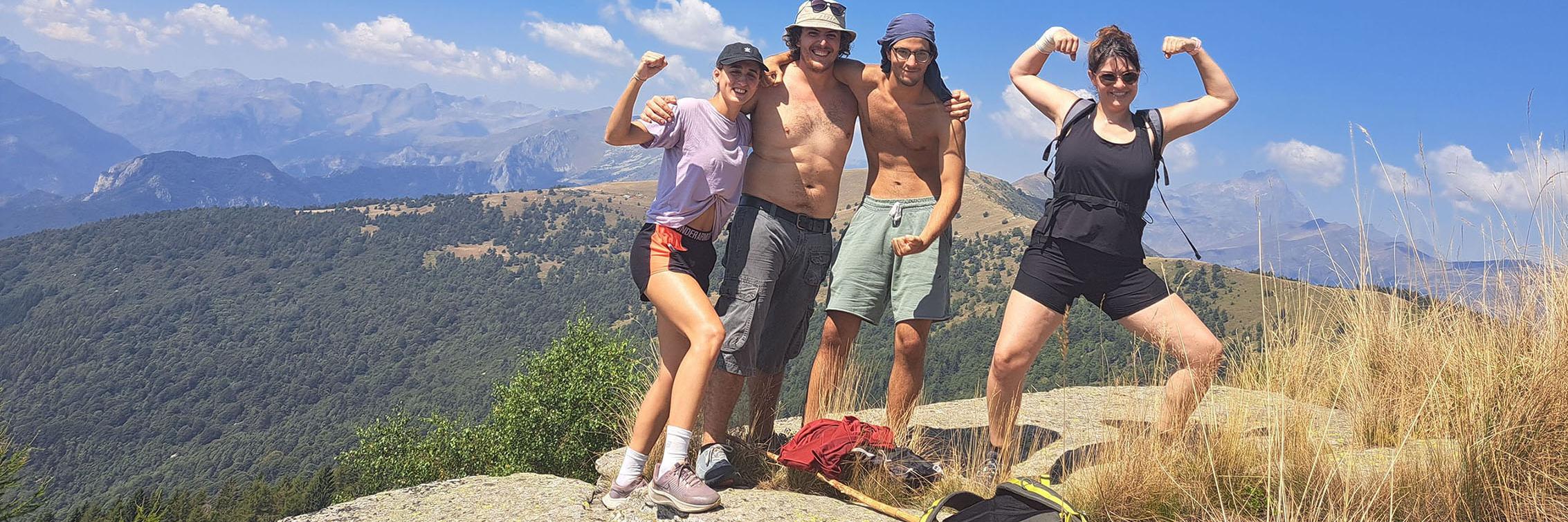 Four members of SYLE pose on mountain top in Italy